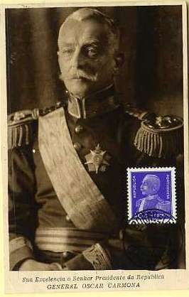 19lis0373.jpg -      Lote:       0373                Descrição:       General Óscar Carmona. Postal ilustrado com a sua efígie, editado pela Agência Geral da Ocogravura, com selo de 40 ctvs violeta da emissão General Carmona CE560, obliterados com carimbo de Chaves (24.11.34).         PM         Valor Base:       &euro; 30,00       Valor Venda:       &euro;      