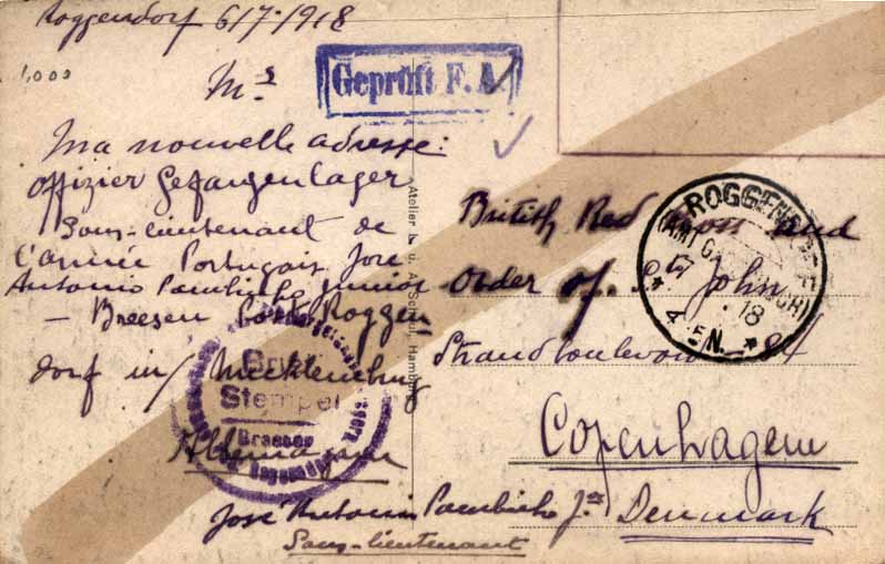 24Lis1078.jpg -     Lote:    1078                   Descrição:         1.ª Guerra Mundial. Prisioneiros de Guerra Portugueses. Postal ilustrado circulado isento de franquia de Roggendorf (07.07.18) para a Cruz Vermelha Inglesa em Copenhaga, dando conhecimento do seu novo endereço. B e R.        PI       Valor Base:     &euro; 60,00     Valor Venda:     Retirado     