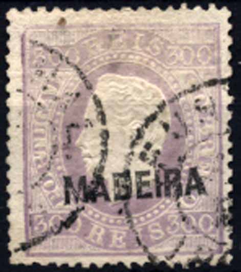 24Lis1537.jpg -     Lote:    1537            Madeira       Descrição:         1870/76 &mdash; D. Luís I. Fita direita com sobrecarga MADEIRA. Sobrecarga C. CE25, 300 reis violeta, denteado 13 &frac12;. Valor de catálogo &euro; 113,00.        O       Valor Base:     &euro; 25,00     Valor Venda:     &euro; 50,00     