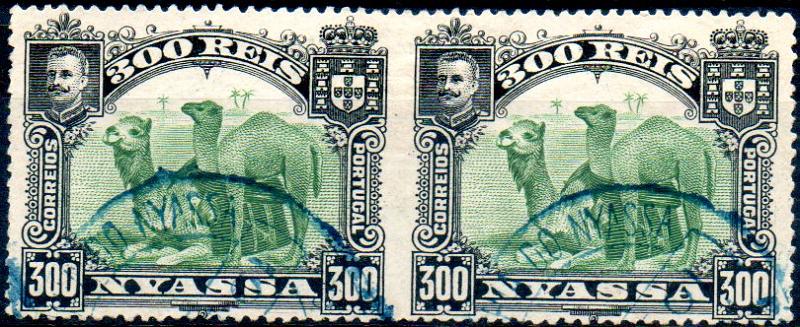 0025.jpg -     Lote:    25      Colecção IMPÉRIO      Companhia do Niassa       Descrição:         1901 &mdash; D. Carlos I (Girafa e Camelos). CE39, 300 reis verde. Par horizontal não denteado verticalmente ao centro. MB e MR.        O       Valor Base:     &euro; 50,00     Valor Venda:     &euro; 130,00     