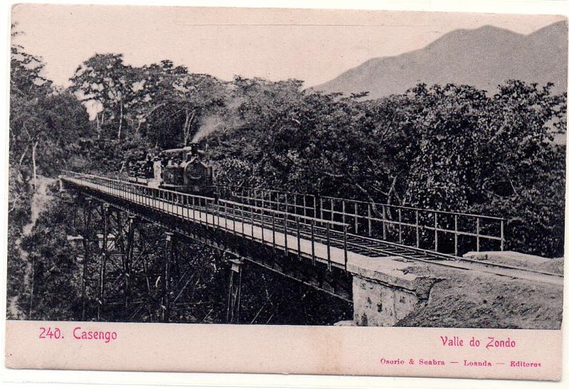 0615.jpg -     Lote:    615                   Descrição:         Angola. Casengo. Valle do Zondo. Locomotiva sobre ponte ferroviária. Novo.        PI       Valor Base:     &euro; 8,00     Valor Venda:     &euro; 8,00     
