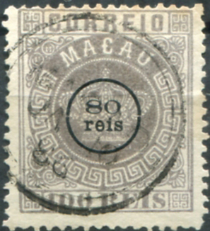 593.jpg -     Lote:    593                   Descrição:         1884 &mdash; Coroa, com sobretaxa. MF10d, 80 reis s/ 100 reis lilás malva, papel liso fino, denteado 13 &frac12;, com "e" de "reis" sem acento. Exemplar com boa cor, sem defeitos ou reparações. Valor de catálogo &euro; 240,00.         O       Valor Base:     &euro; 50,00     Valor Venda:     &euro;      