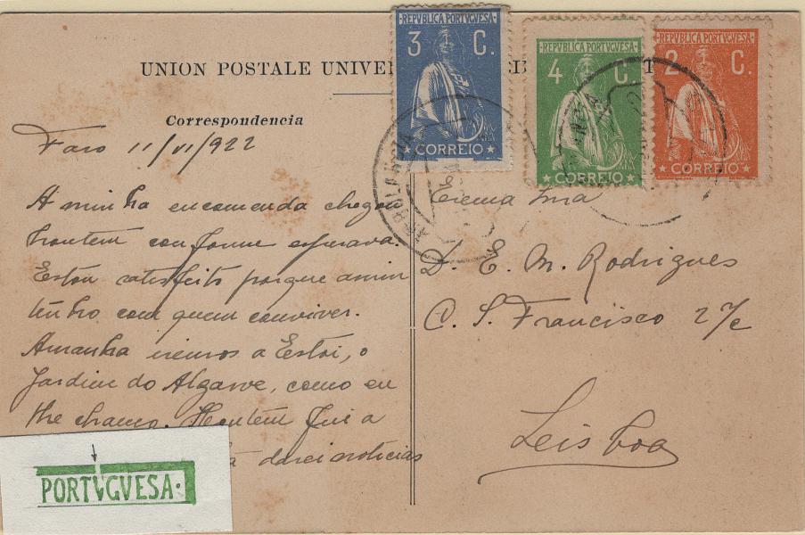 0589.jpg -     Lote:    589                   Descrição:         1917/22 &mdash; Ceres. Novas taxas e cores. Postal ilustrado circulado de Faro (11.06.22) para Lisboa com selo de 2c laranja, papel pontinhado, denteado 12x11 &frac12;, Mf223n, selo de 3c azul, papel acetinado, denteado 15x14, Mf235e e 4c verde, papel acetinado, denteado 15x14, Mf226i, com variedade de cliché MM VII (x15) no total de 9c, para pagar: 6c pelo porte simples de bilhetes postais ilustrados e 3c pela taxa de última hora. Acompanha desenho de Eduardo Silva.         PI       Valor Base:     &euro; 20,00     Valor Venda:     &euro;      